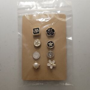CHANEL Black and Gold Button Collection